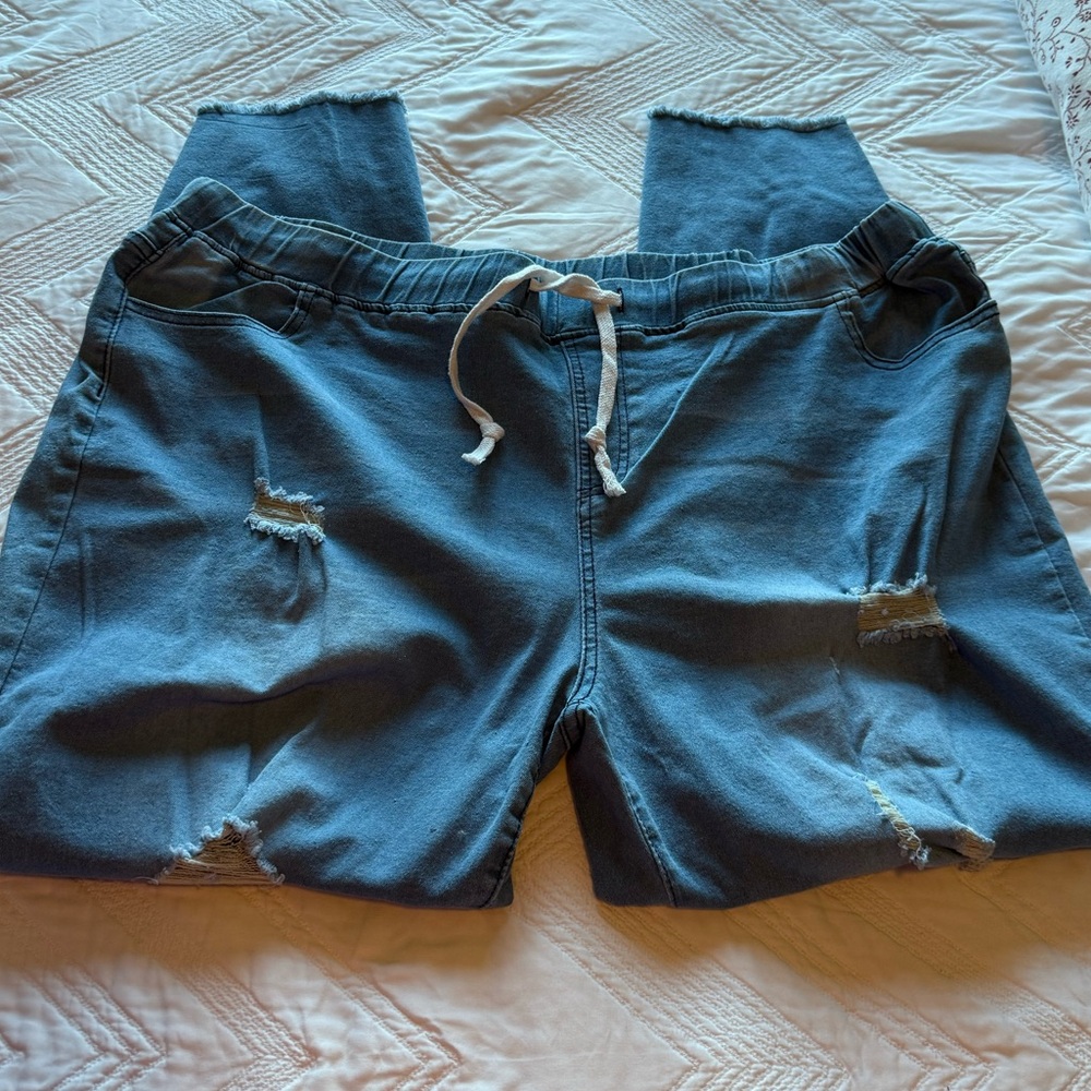 Light blue jeans. Very soft cottony stretchy. Brand new. Distressed. Size 22/24.